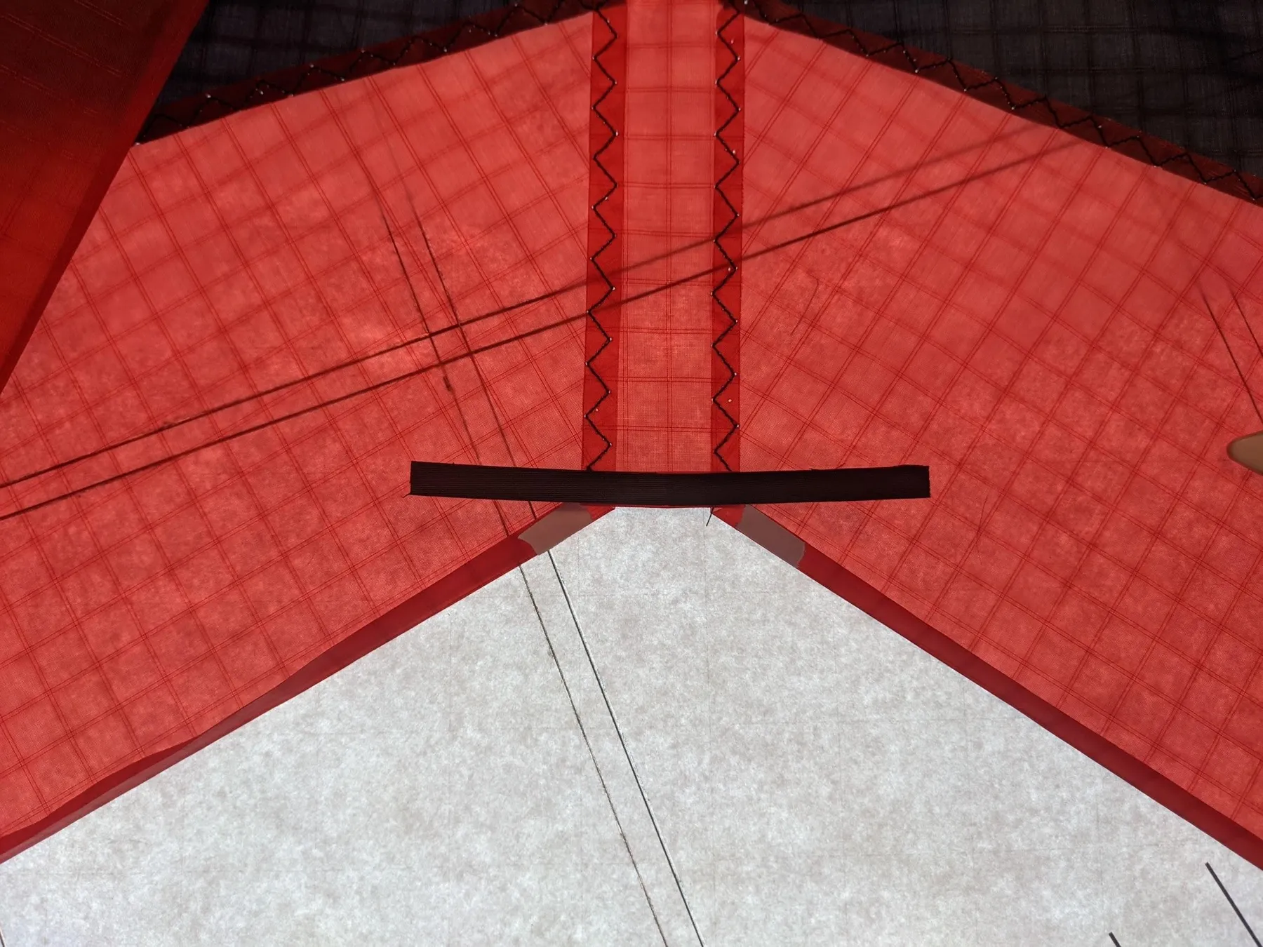 The thin Dacron strip laid along the base of the center panel