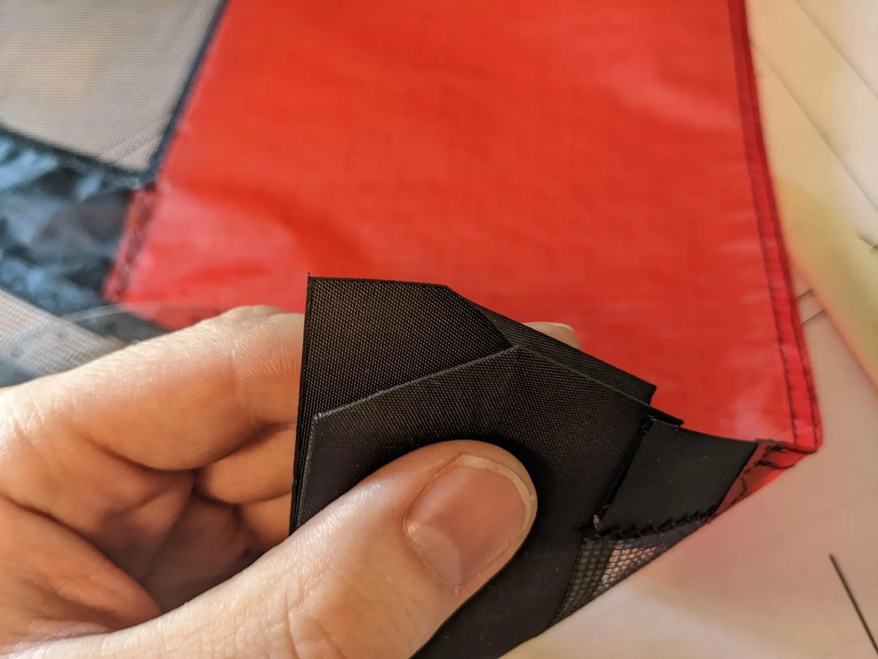 Folding the square around the end, view 2 of 4
