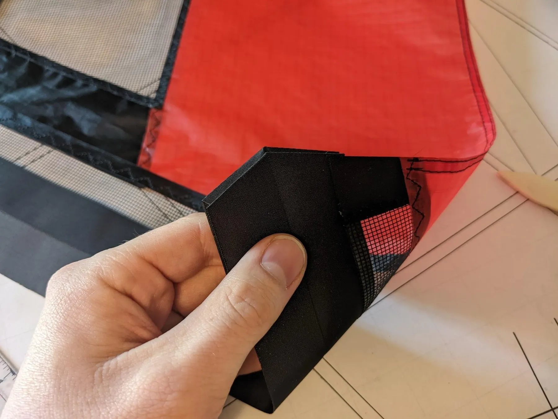 Folding the square around the end, view 3 of 4