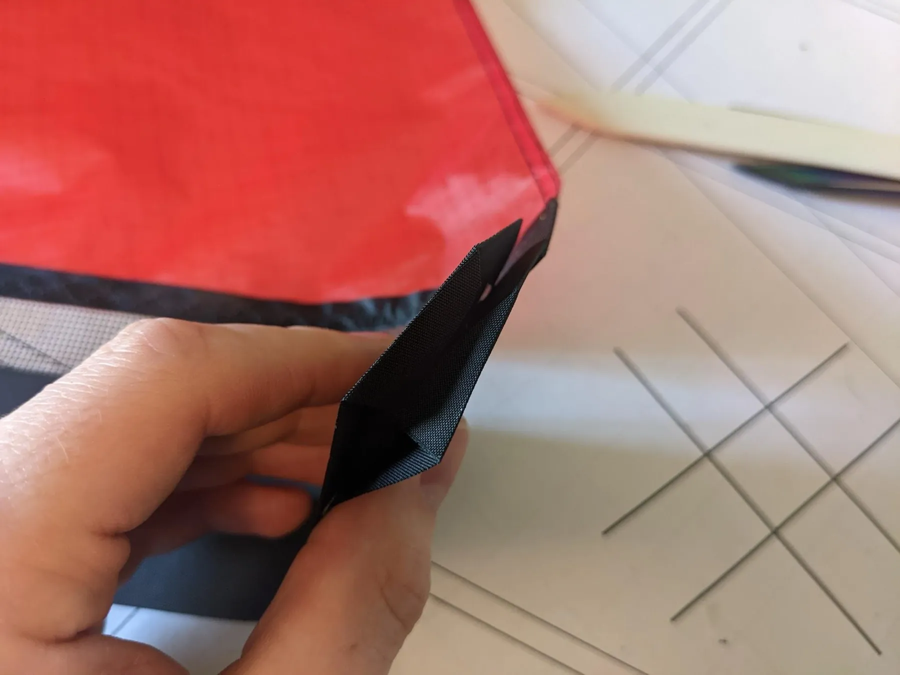 Folding the square around the end, view 4 of 4