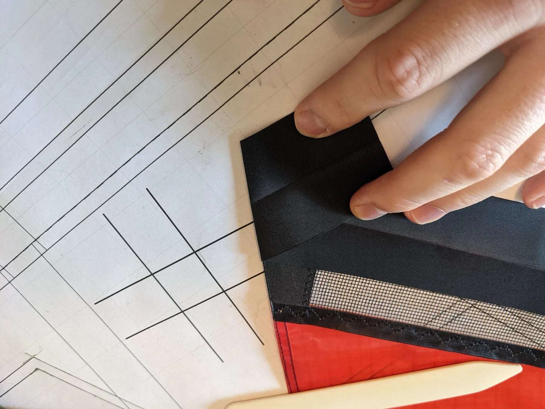 The extra Dacron folded back at the trailing-edge angle
