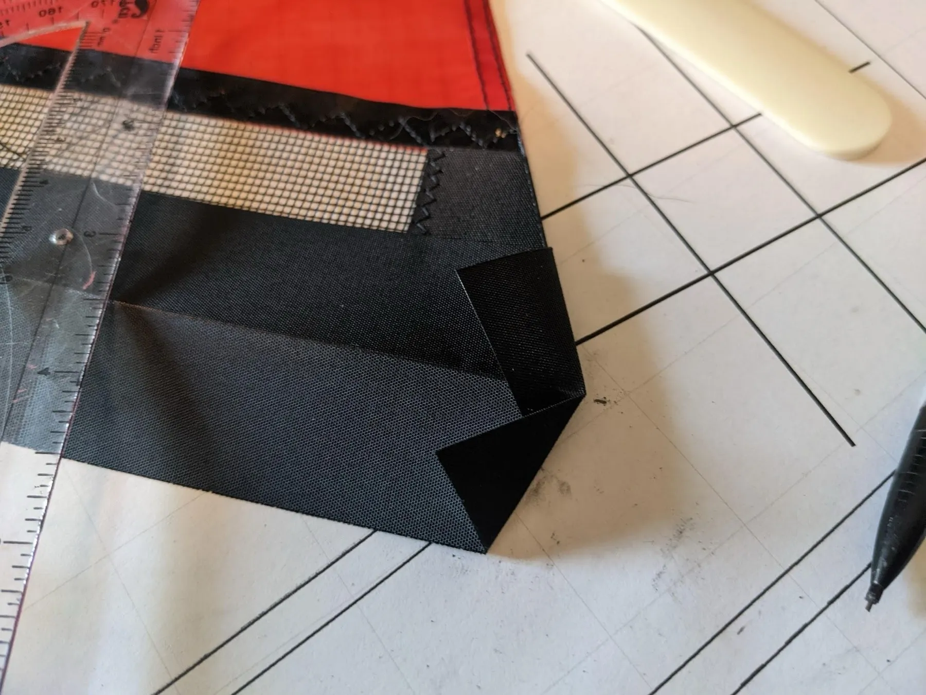 The end of the strip is now pointed, with folded bits on the outside