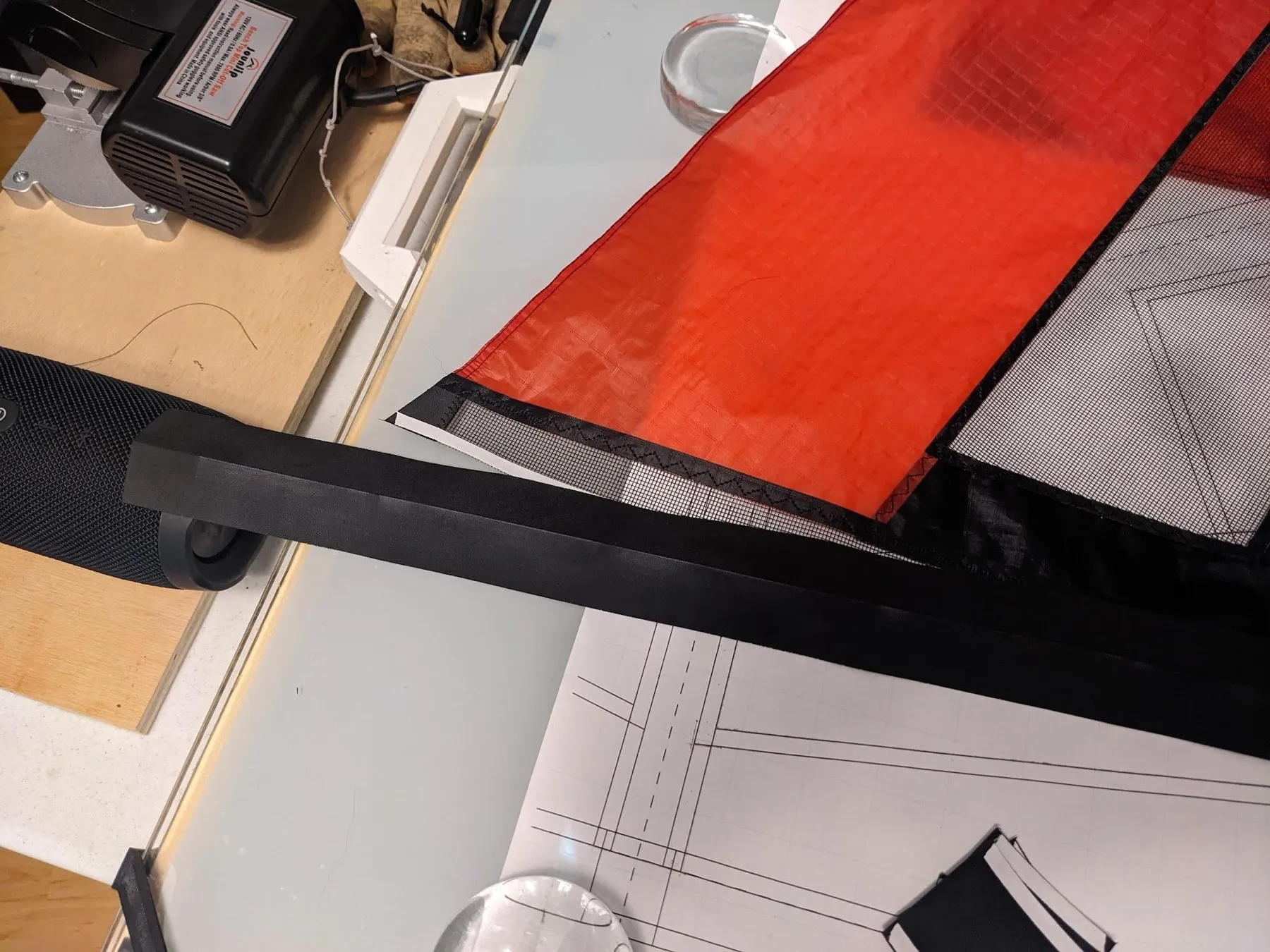 The leading-edge Dacron stuck along the upper edge of the mesh