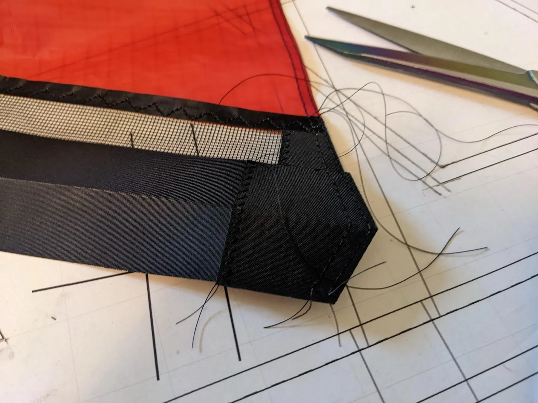 A leading-edge tip sewn with two parallel lines of straight stitching