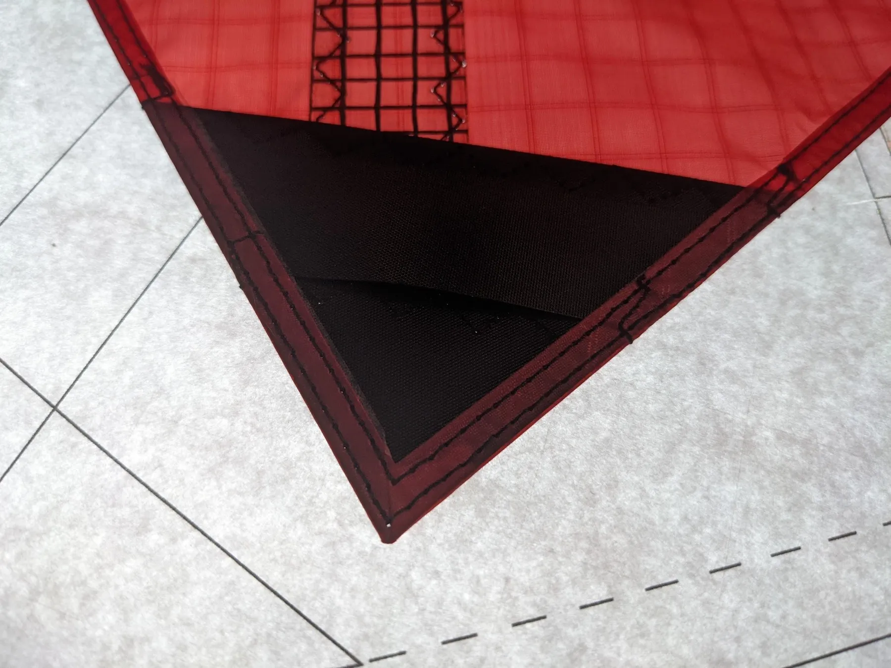Wing tip after the two parallel lines of stitching along the trailing edge