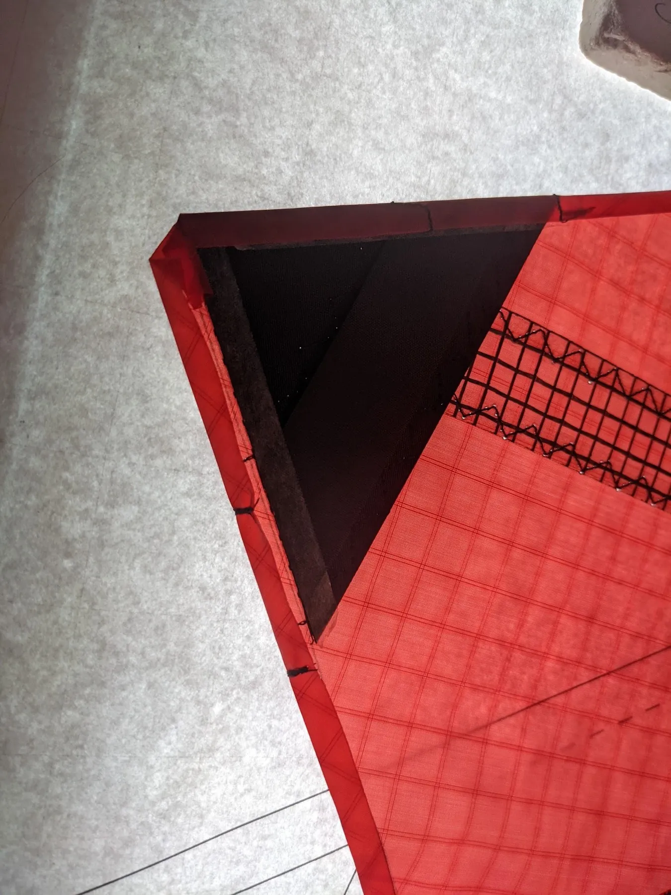 Left wing tip with both edges of the hem folded