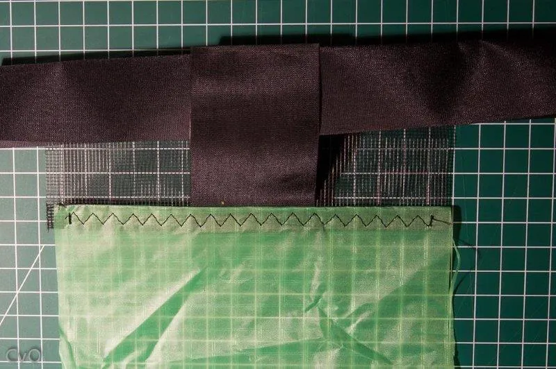 Slide the Dacron strip into the reinforcement
