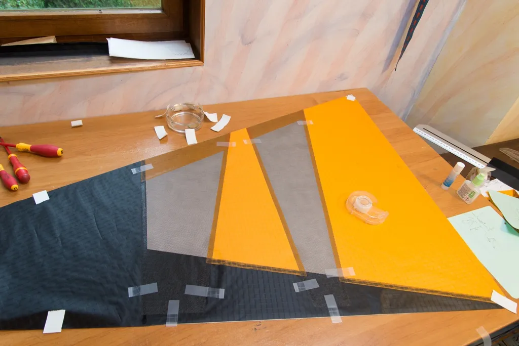 The panels are taped, then glued.