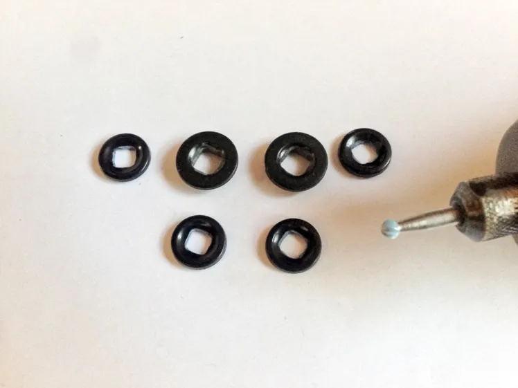 The buttons are drilled