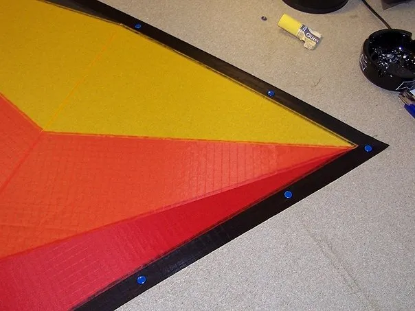 One wing fixed with tacks.