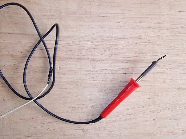 Preparing the soldering iron for cutting the inner panels.