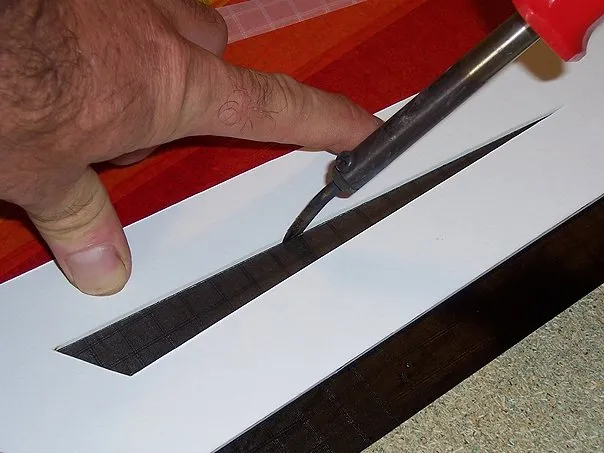 Cutting with soldering iron.