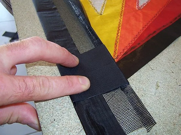 Fitting the dacron reinforcements for the wing tips + folding the black hems.