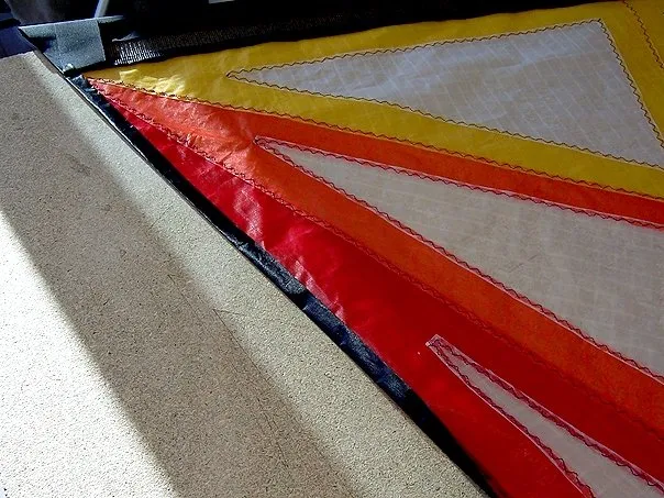 Folding the black trailing edge hems.