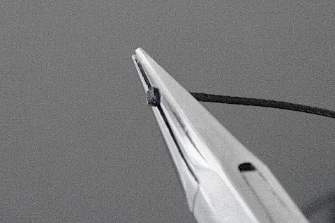 Pressed to the plyers to form a flange